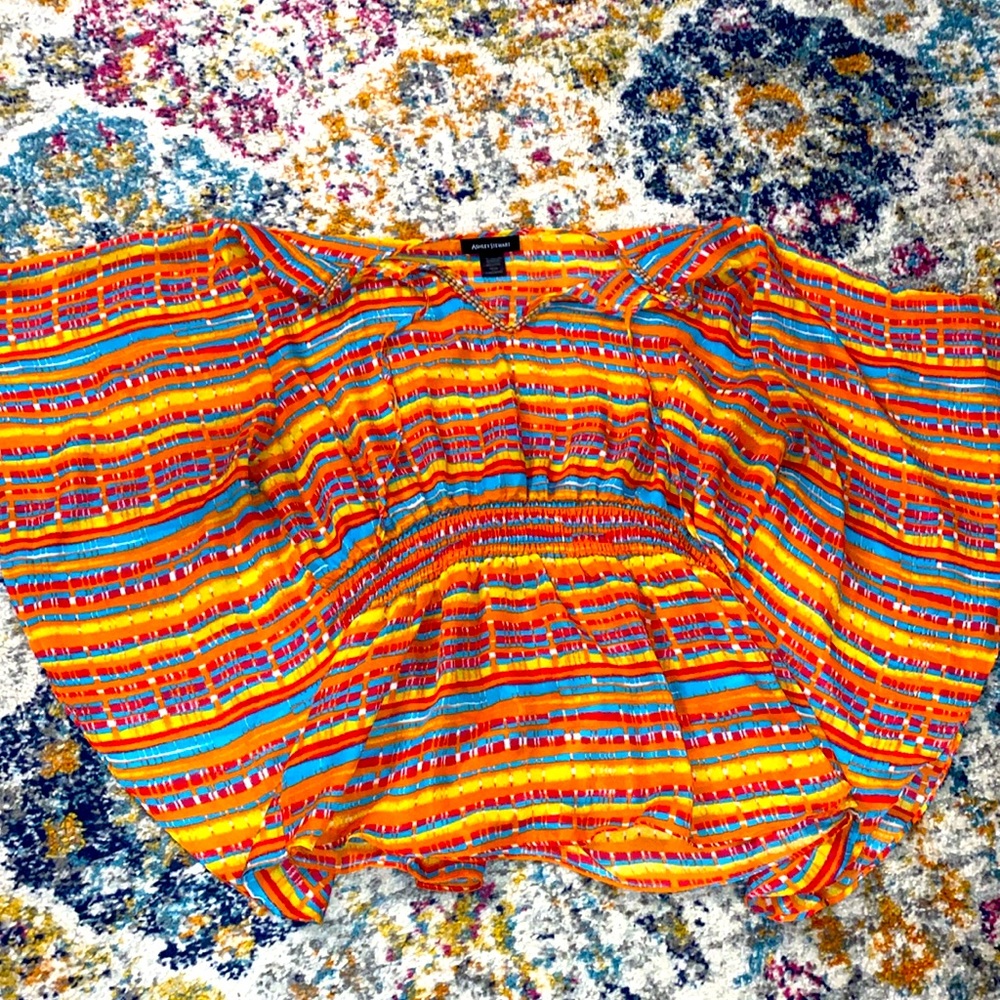 Beautiful, colored blouse ready for a new home